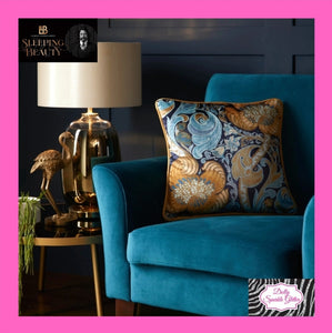 Down the dilly cushion in ochre & blue by Laurence Llewelyn-Bowen